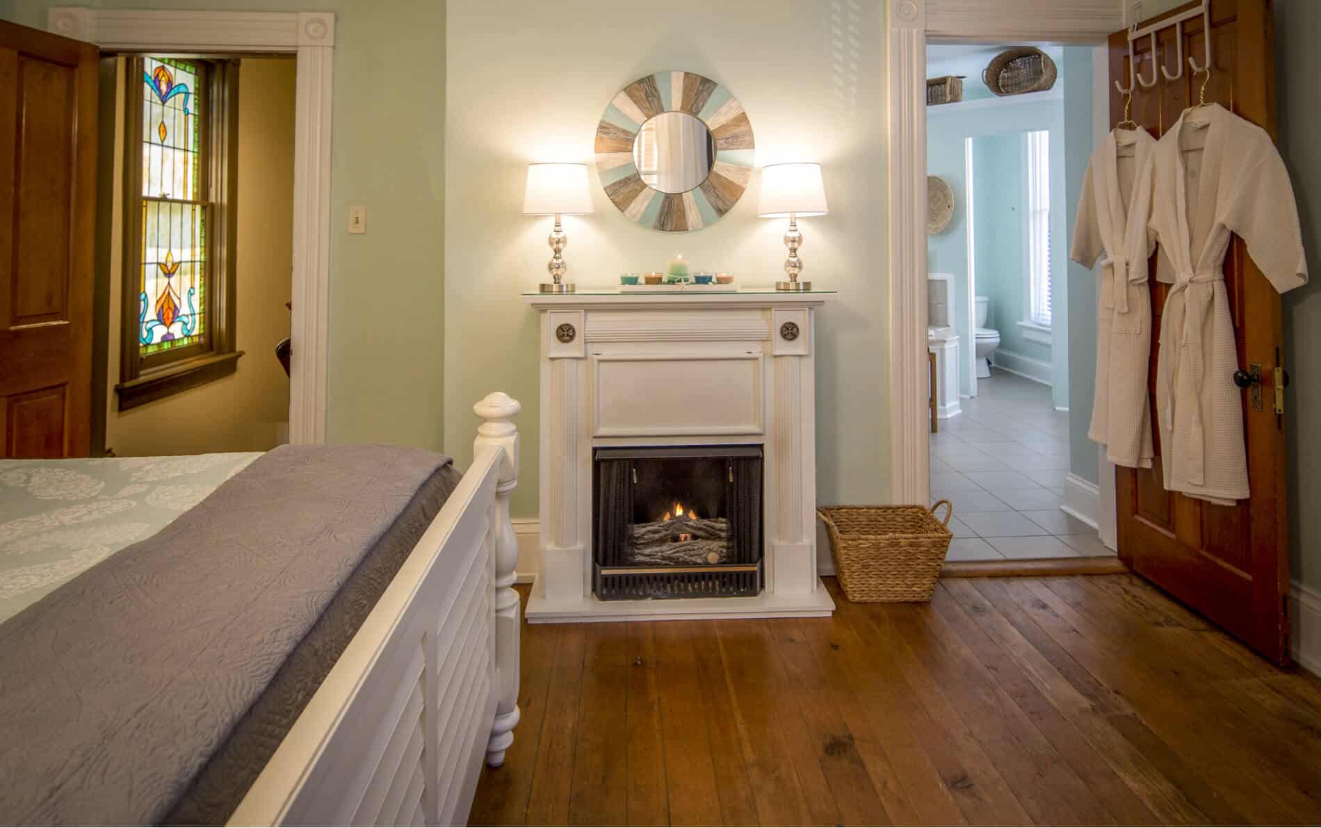 Picture of white fire place in beadroom.